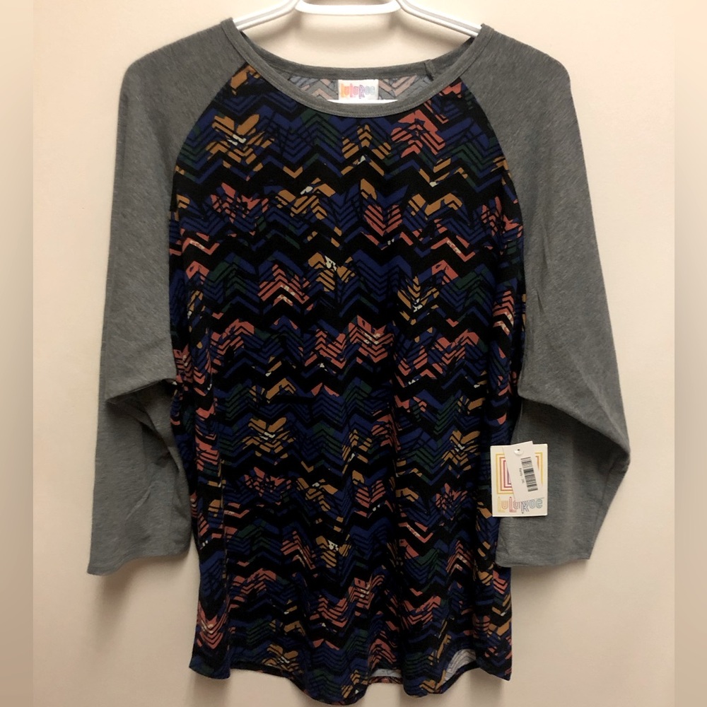 New with tags Lularoe Randy T-shirt, multi coloured print size 3x.